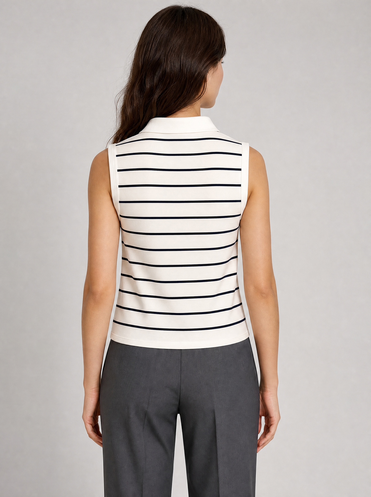 Back view of a cream striped sleeveless knit polo showing the collar and shoulder line