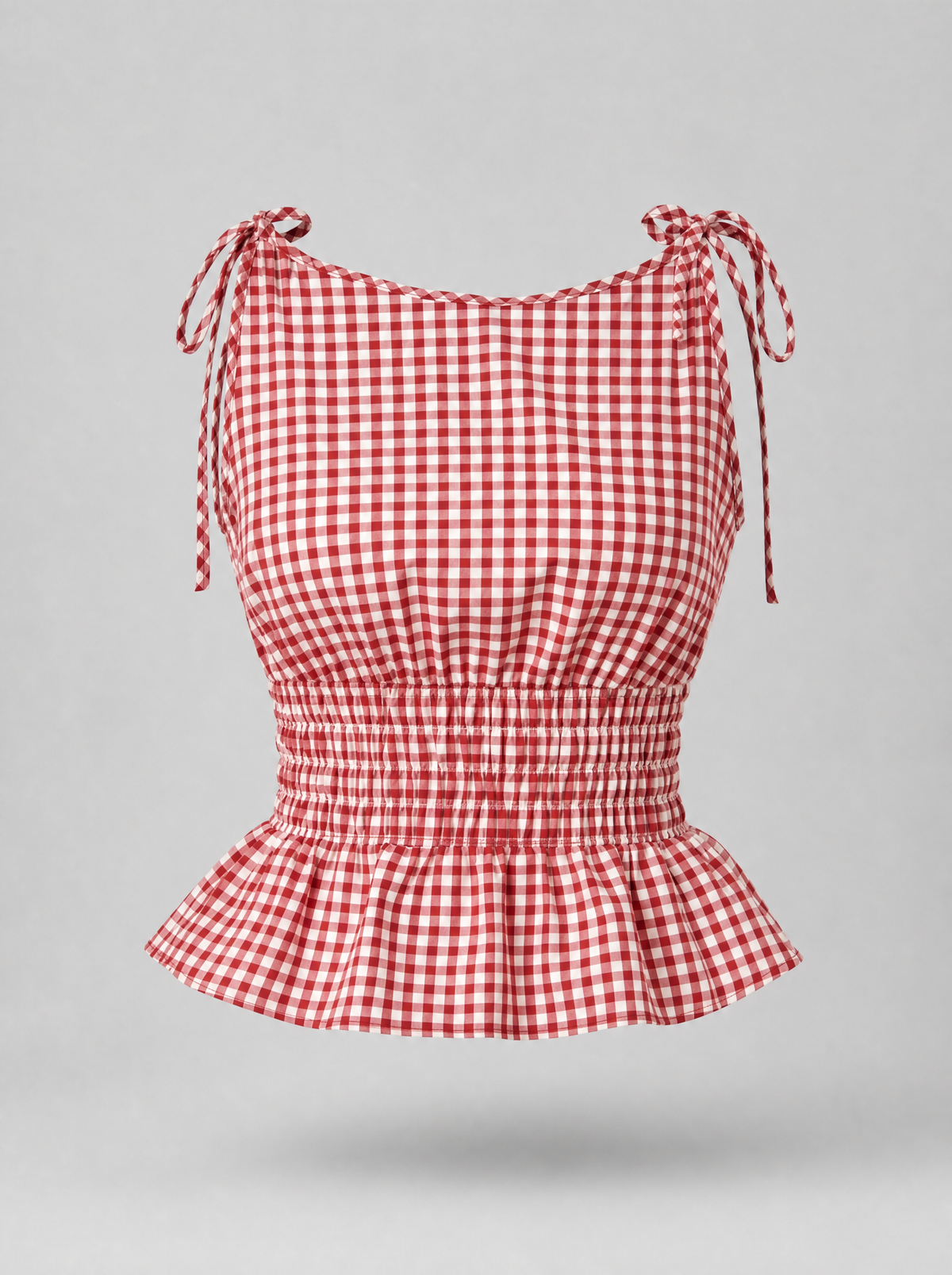 Red gingham tie shoulder peplum top shown on its own against a light grey background