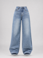 Light wash high waist wide leg jeans shown on their own against a light grey background