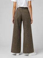 Back view of leopard print wide leg jeans showing the back pockets and yoke
