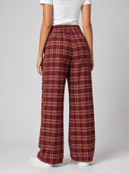 Back view of burgundy plaid wide leg pants showing the elastic waist and leg width