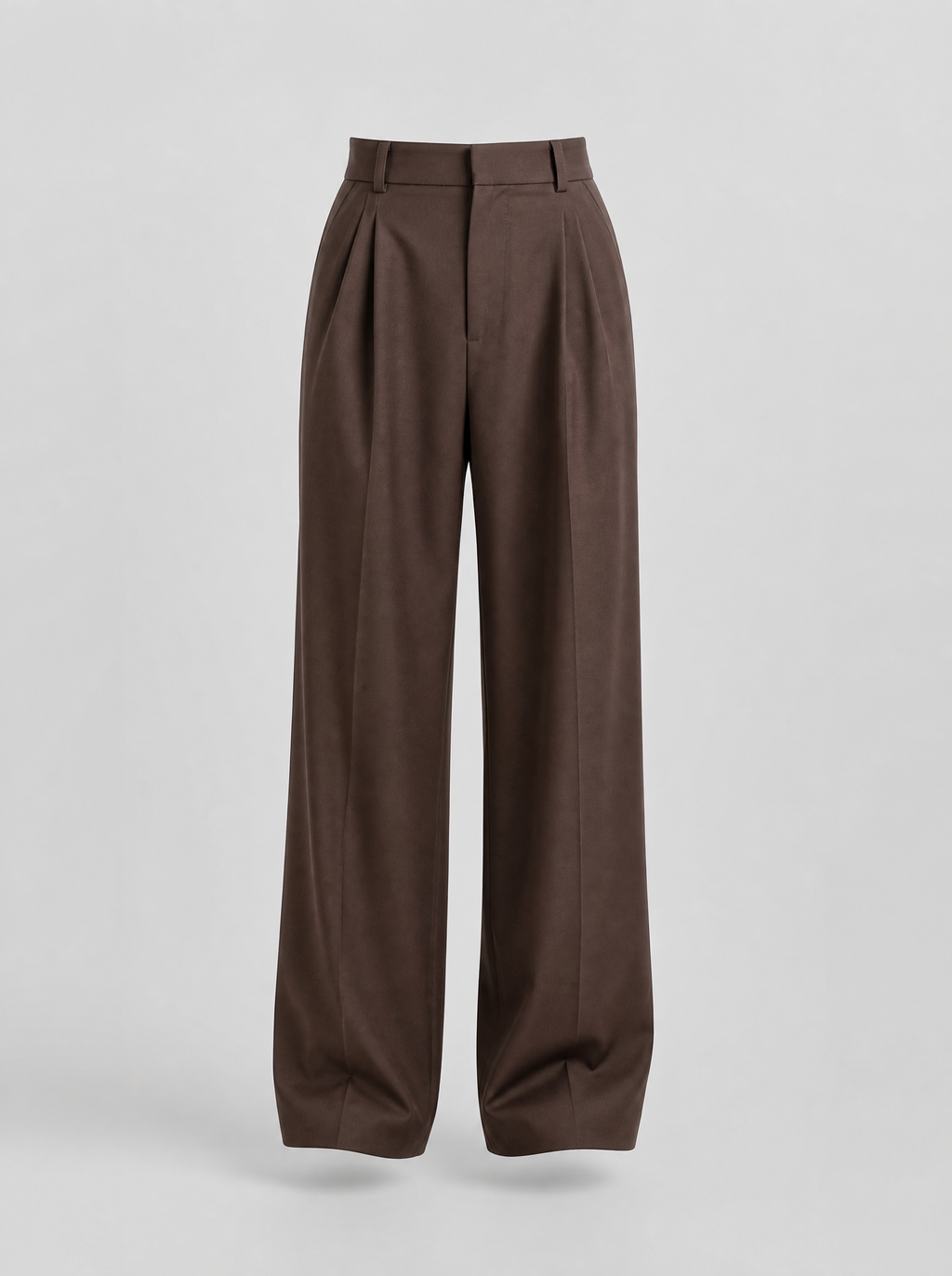Brown pleated wide leg tailored trousers shown on their own against a light grey background