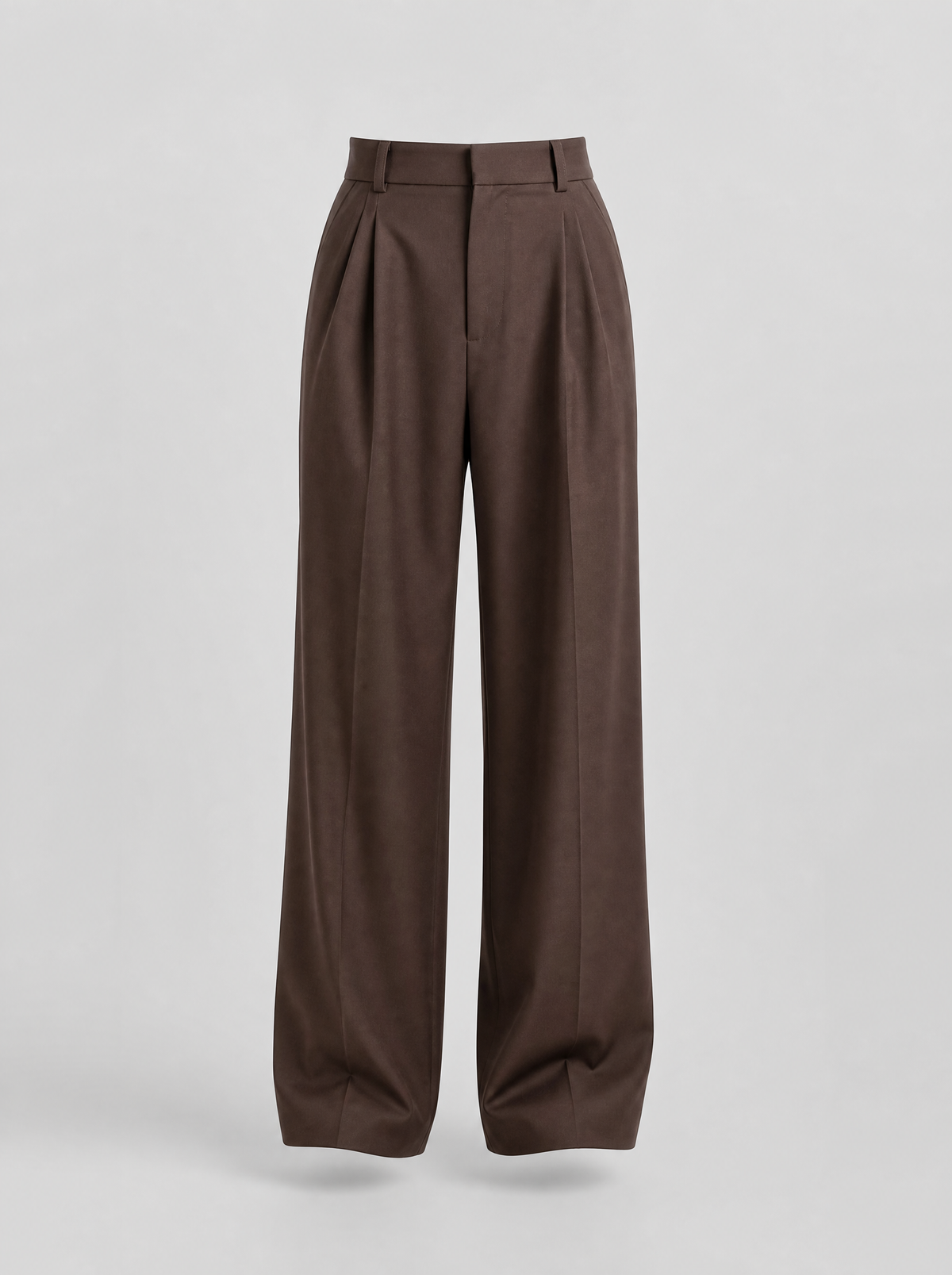 Brown pleated wide leg tailored trousers shown on their own against a light grey background