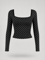 Black polka dot square neck long sleeve top shown on its own against a light grey background