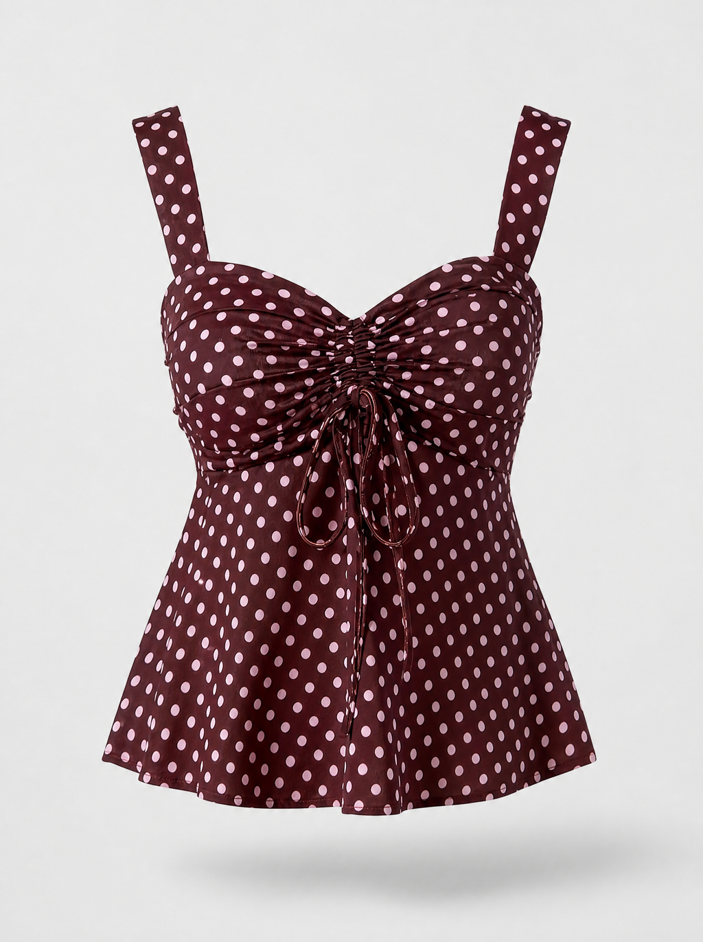 Burgundy polka dot ruched cami blouse shown on its own against a light grey background