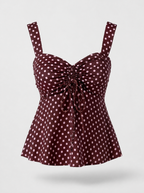 Burgundy polka dot ruched cami blouse shown on its own against a light grey background
