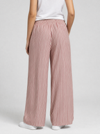 Back view of red striped wide leg pants showing the elastic waist and leg width