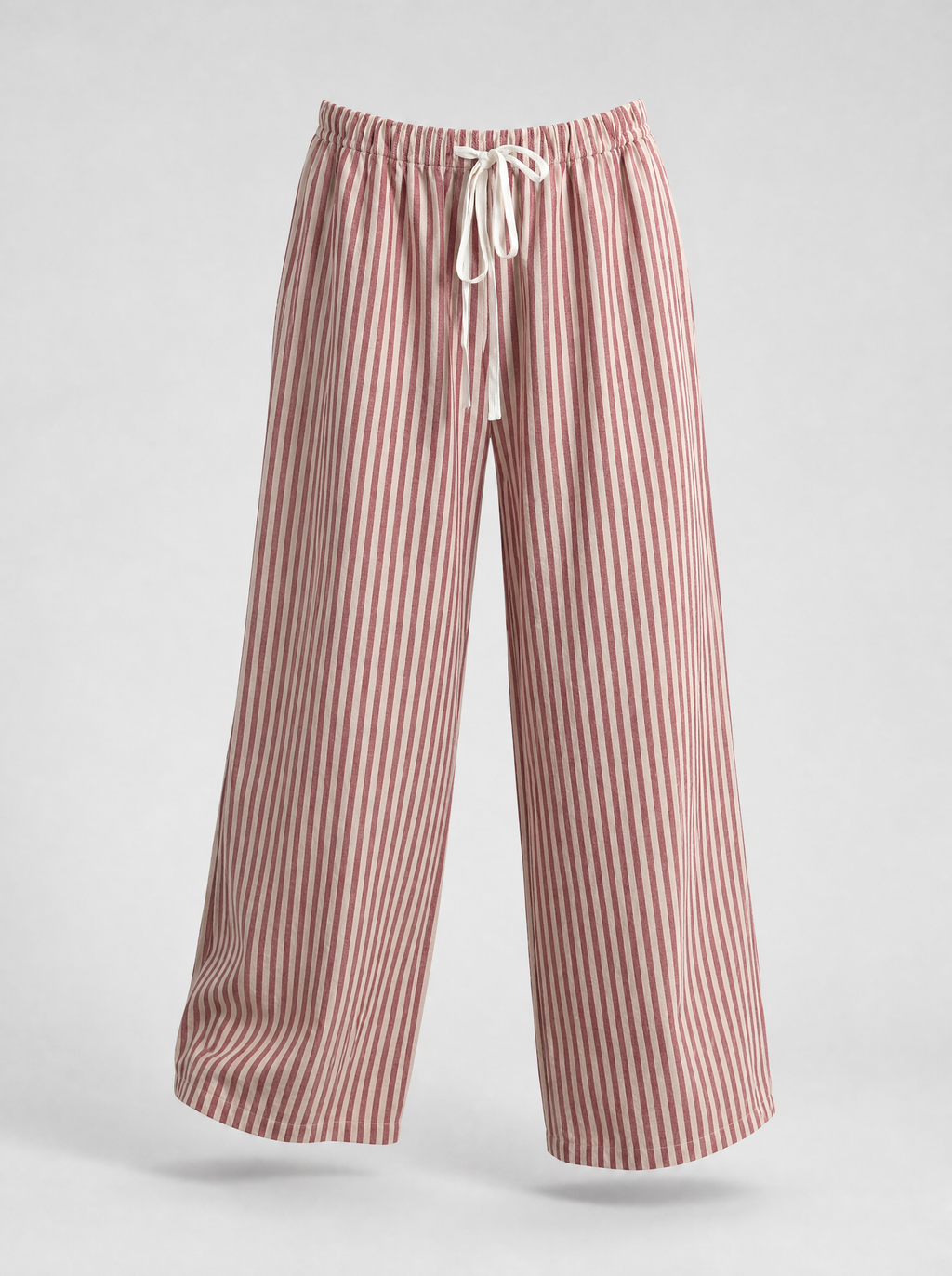 Red striped lightweight wide leg pants shown on their own against a light grey background