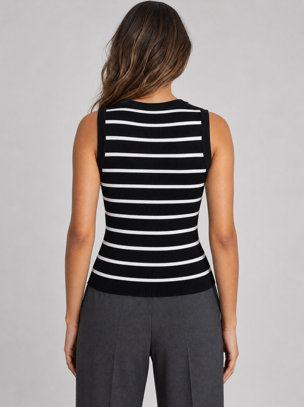 Back view of a black and white striped ribbed knit tank top showing the crew neck