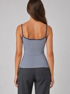 Back view of a navy striped cami top showing the thin straps and back neckline