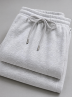 Close up of the drawstring waistband and brushed fleece on grey sweatpants