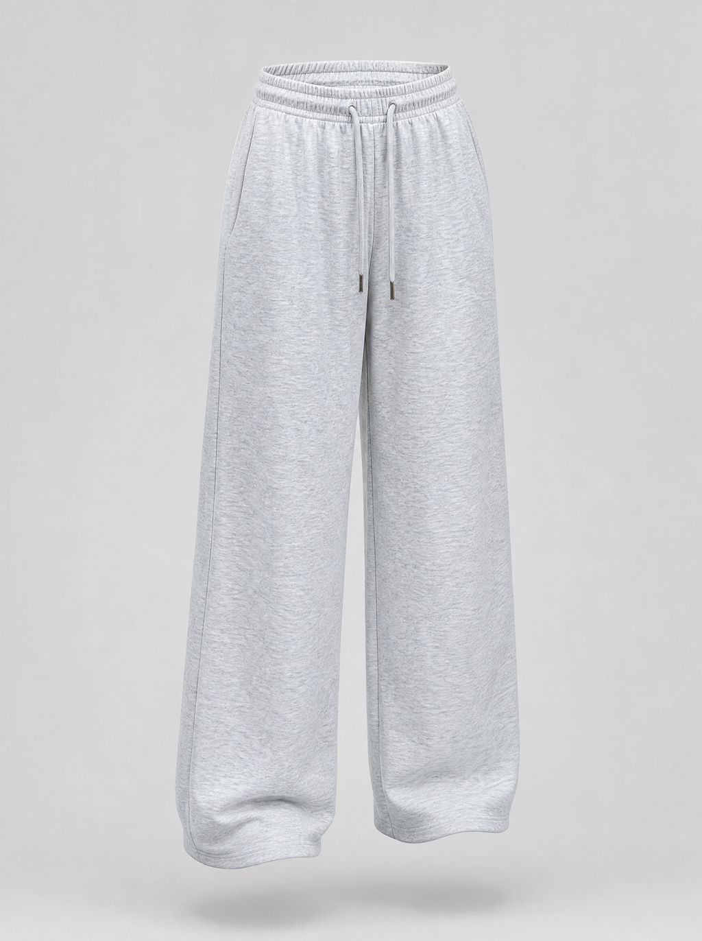 Grey wide leg fleece sweatpants shown on their own against a light grey background