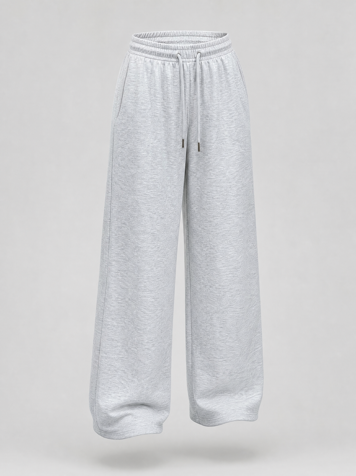 Grey wide leg fleece sweatpants shown on their own against a light grey background